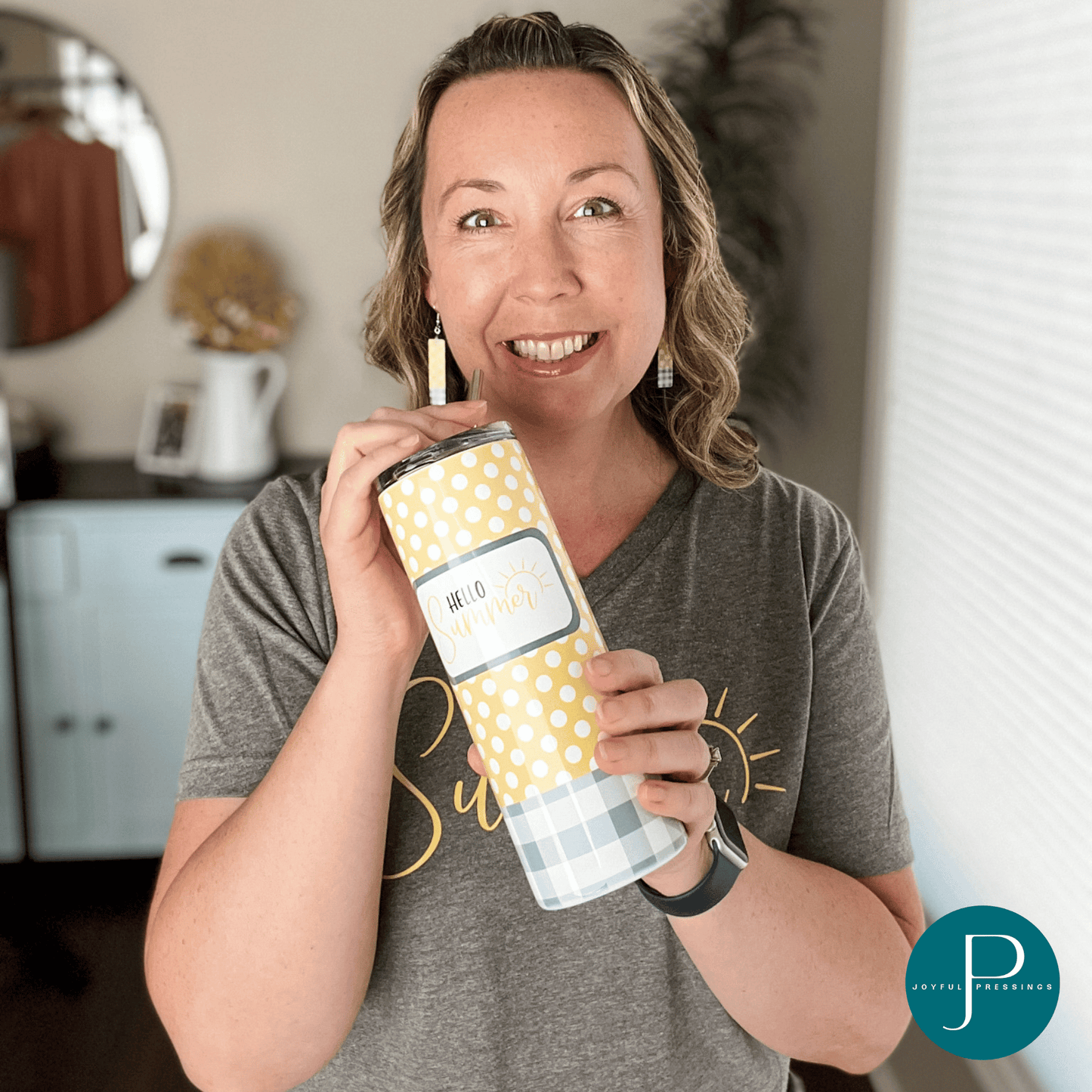 model holding "Hello Summer" tumbler