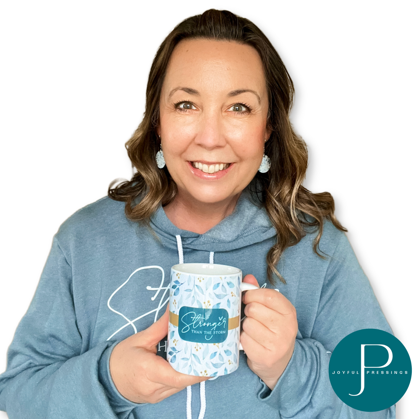 Model holding Stronger Than the Storm mug.