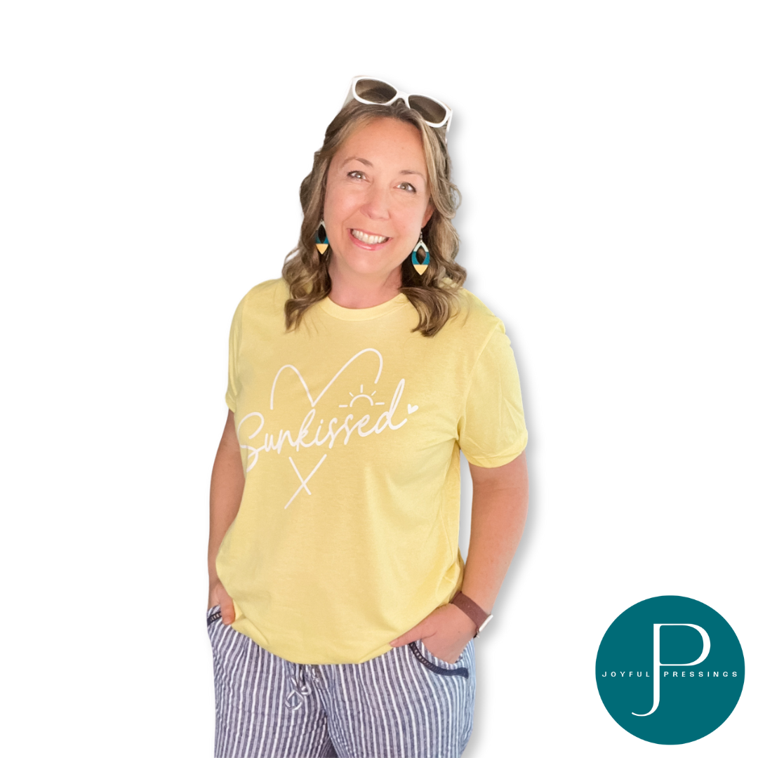 model waring sunkissed on a yellow tee