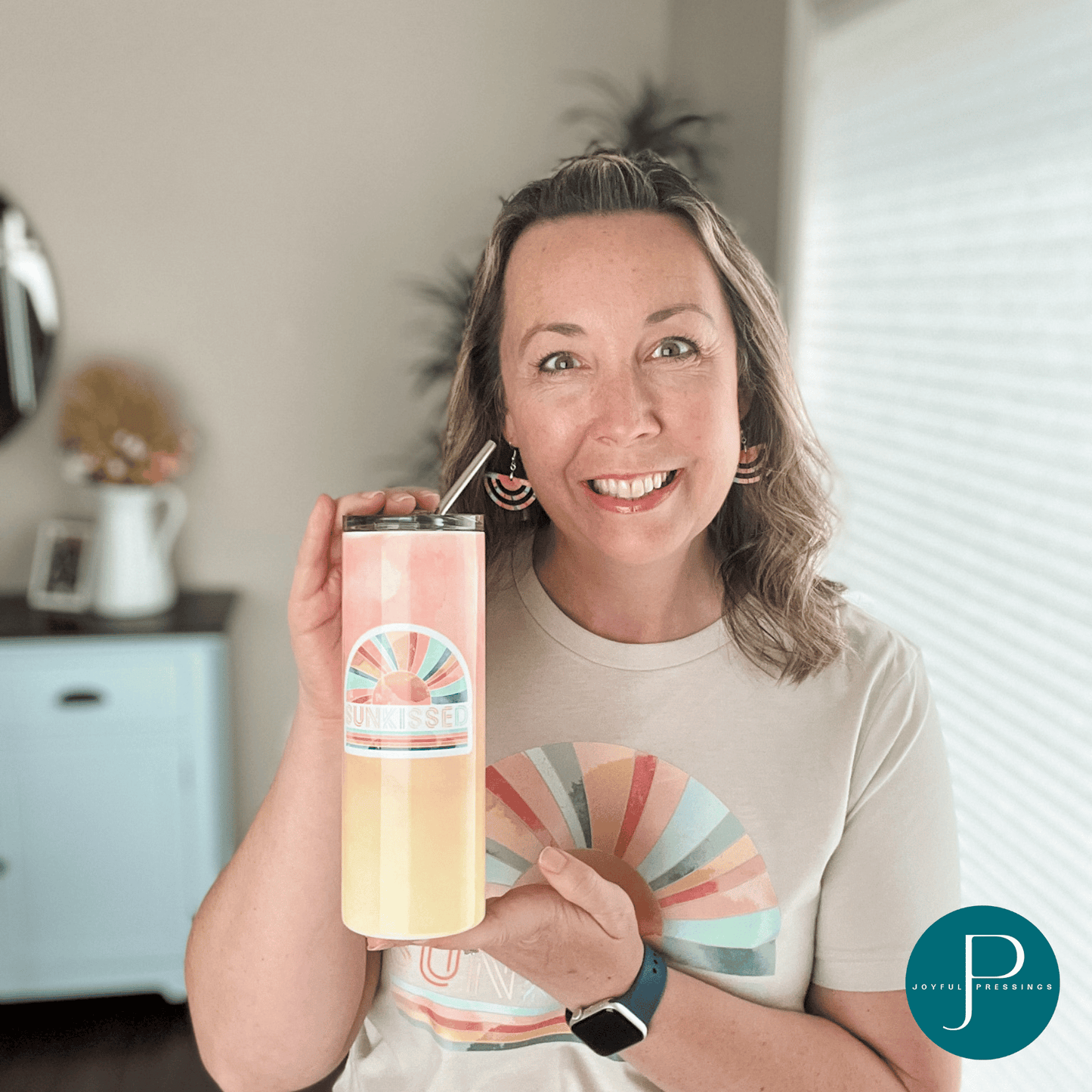 model holding the sunkissed tumbler.