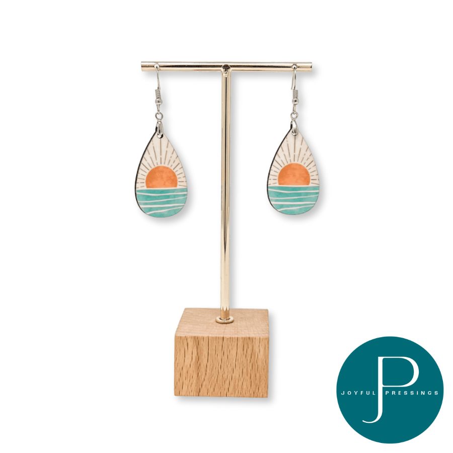display of sunrise earrings on wood display