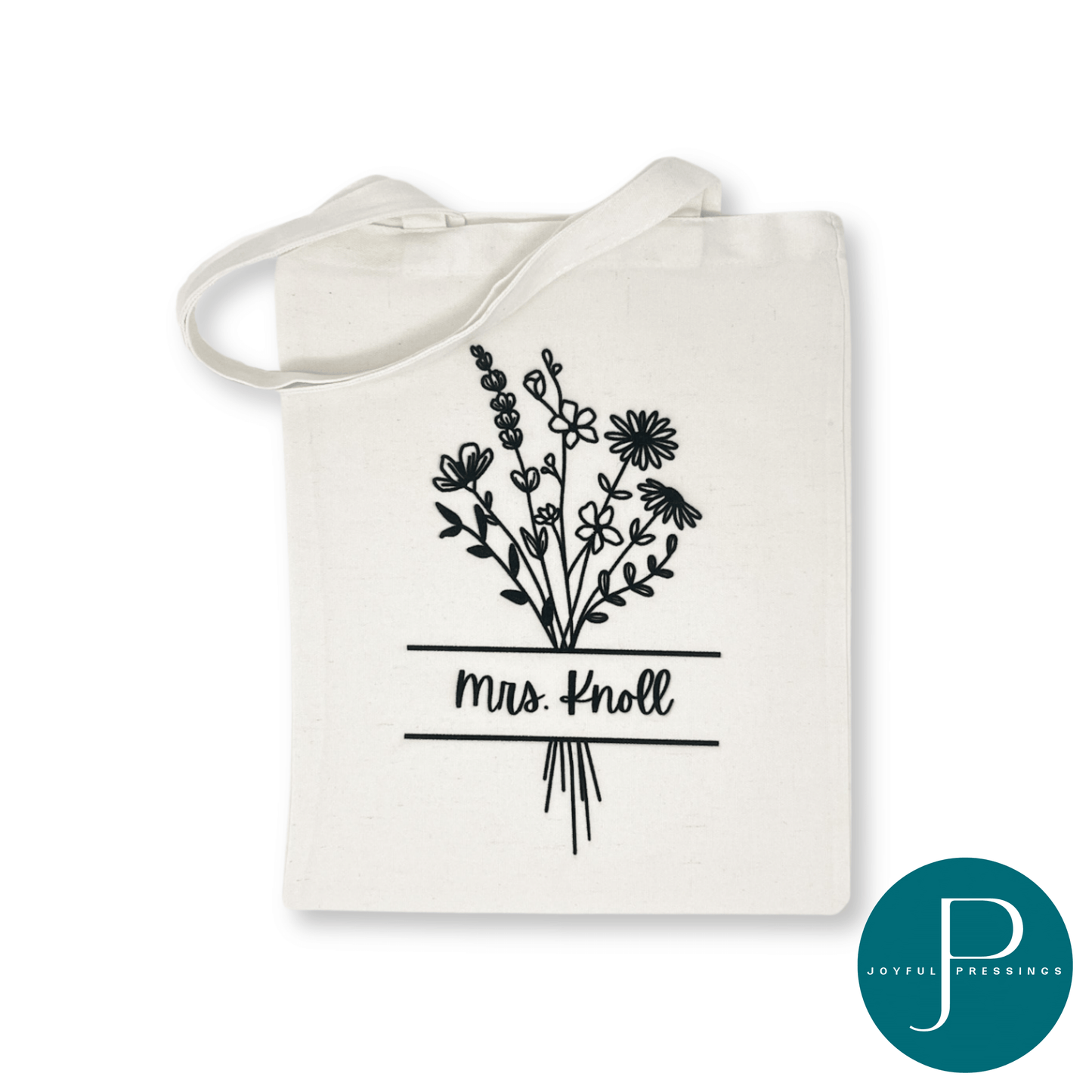 picture of empty floral tote with teacher's name on the front