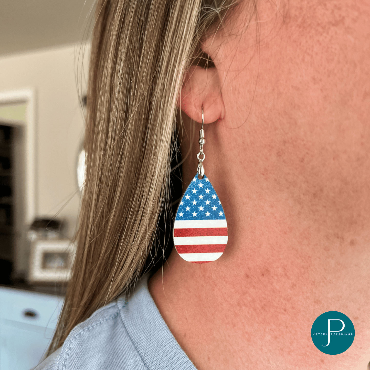 American Flag Teardrop earrings on a model.