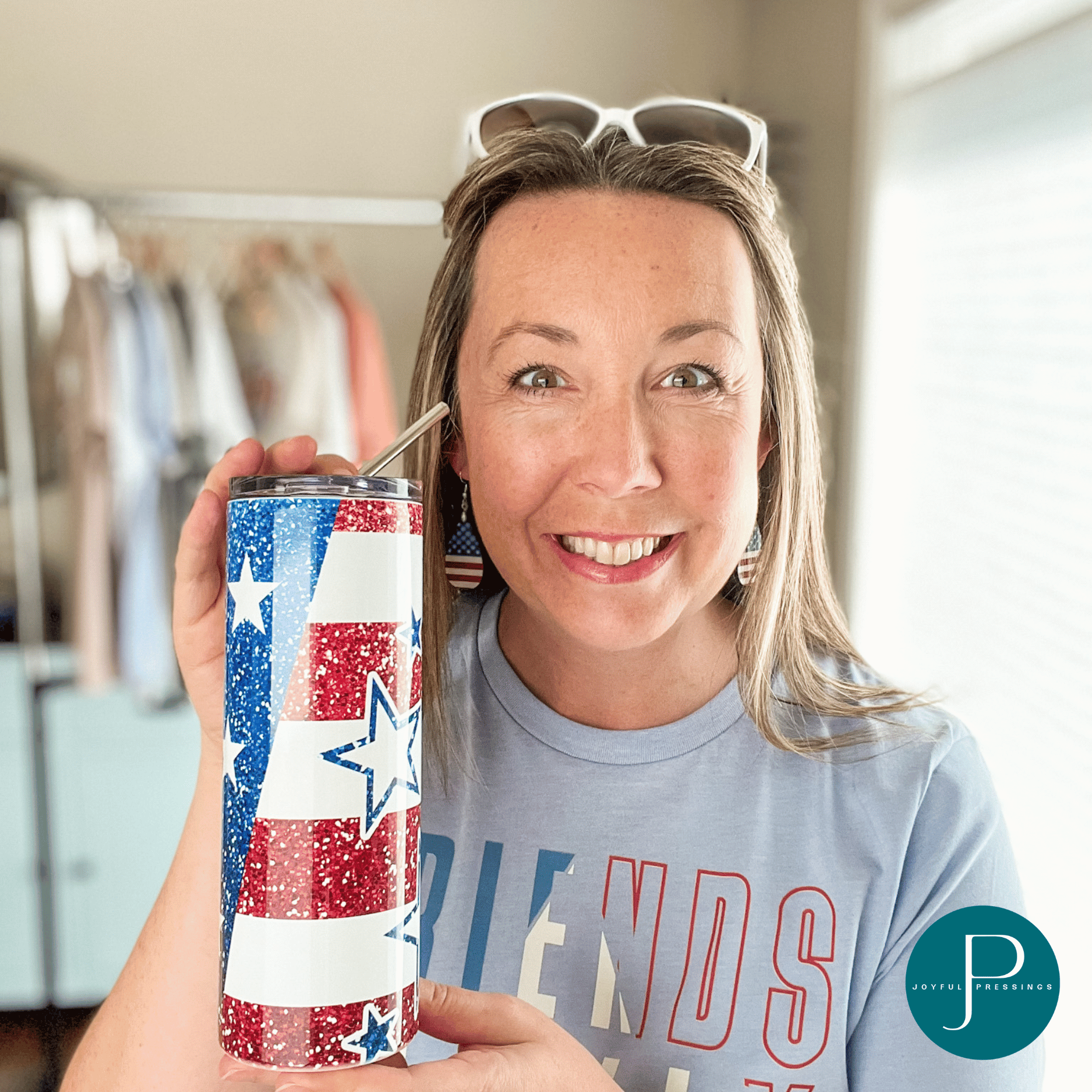 picture of model holding the American Flag tumbler