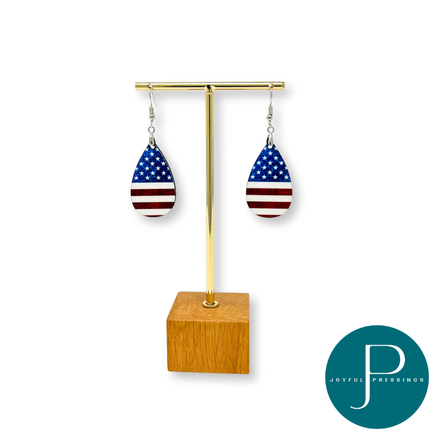 American Flag Teardrop earrings on a display.