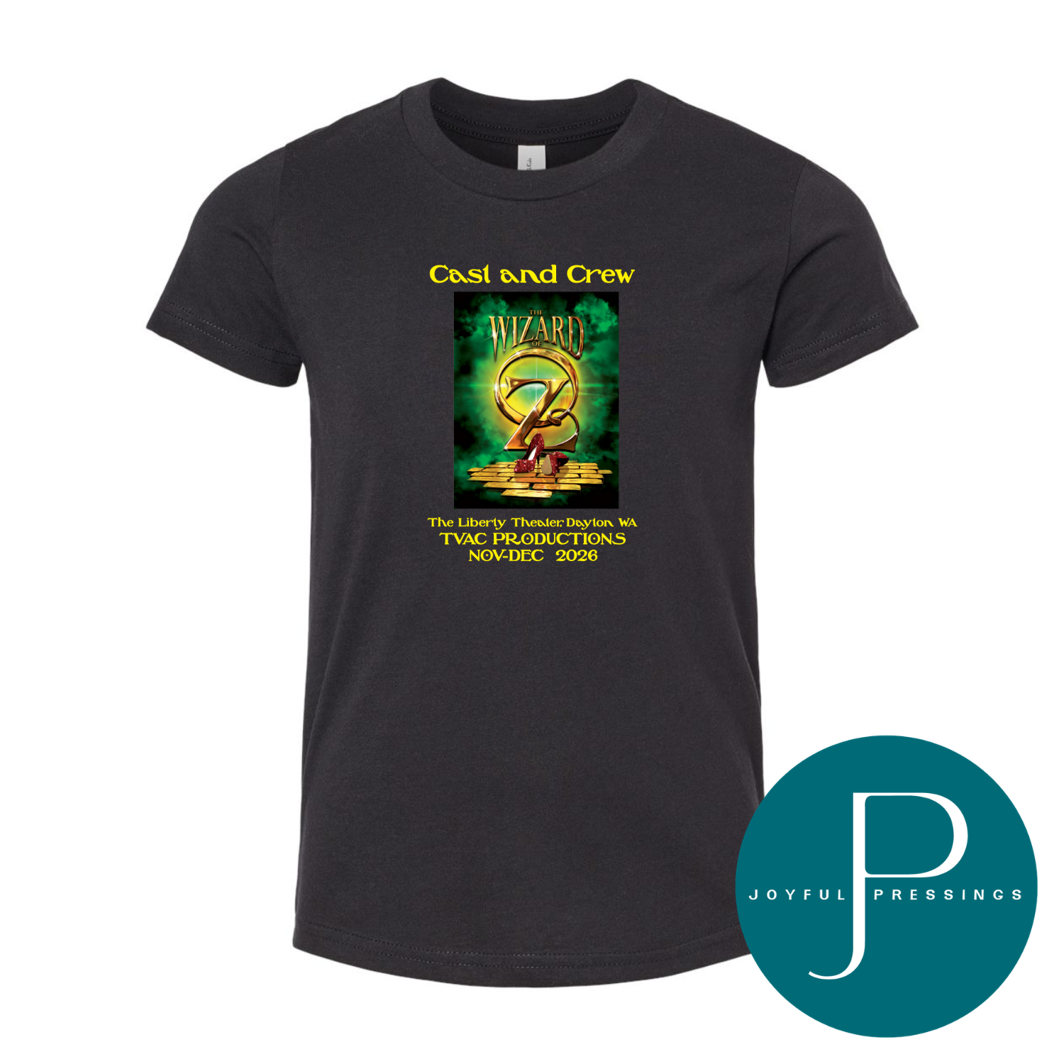 A black short-sleeve t-shirt with a green and gold graphic print on the front reading 'Cast and Crew' for the Wizard of Oz TVAC production. The shirt is displayed on a clean white background with a teal circular 'Joyful Pressings' logo overlay in the bottom right corner.