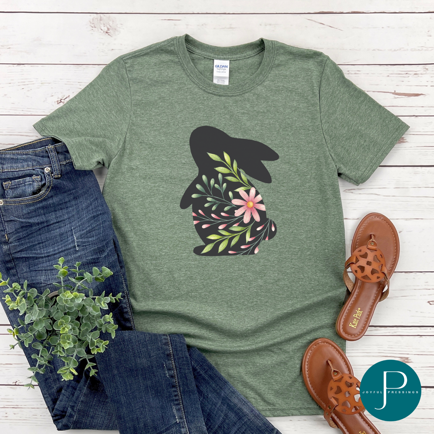 T-shirt mockup of spring bunny on a cactus green Gildan softstyle tee.