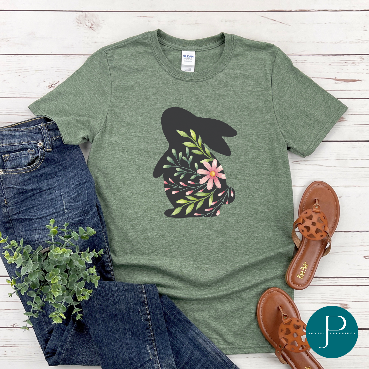 T-shirt mockup of spring bunny on a cactus green Gildan softstyle tee.