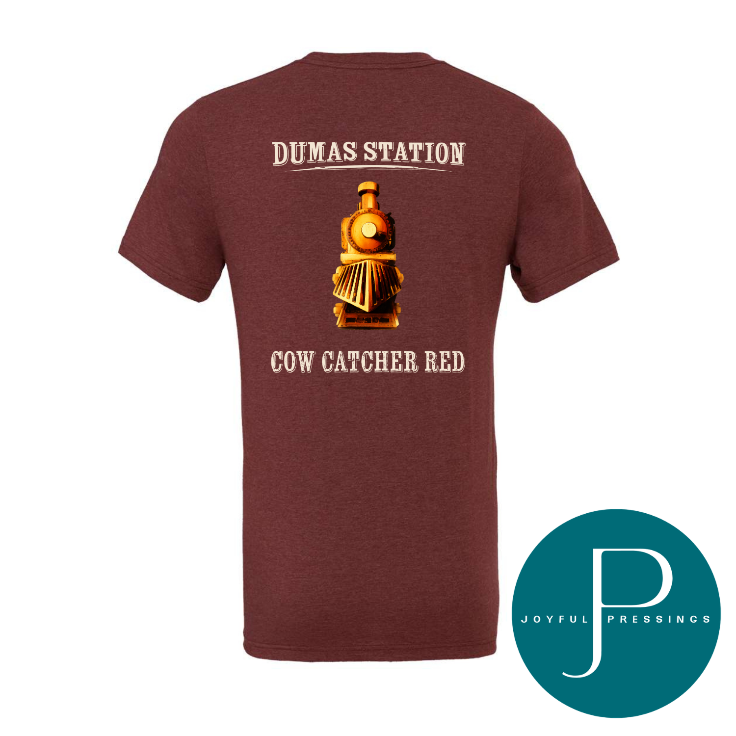 Maroon t-shirt with 'Dumas Station Cow Catcher Red' design on a white background, featuring the Joyful Pressings logo.