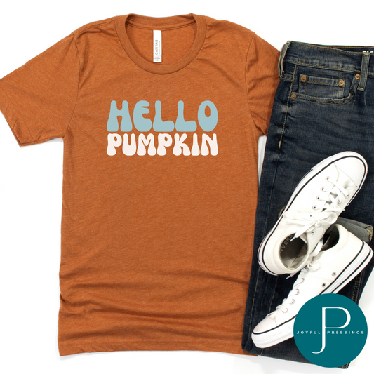 Hello Pumpkin print on a rust color tee.  Flatlay with jeans and tennis shoes.