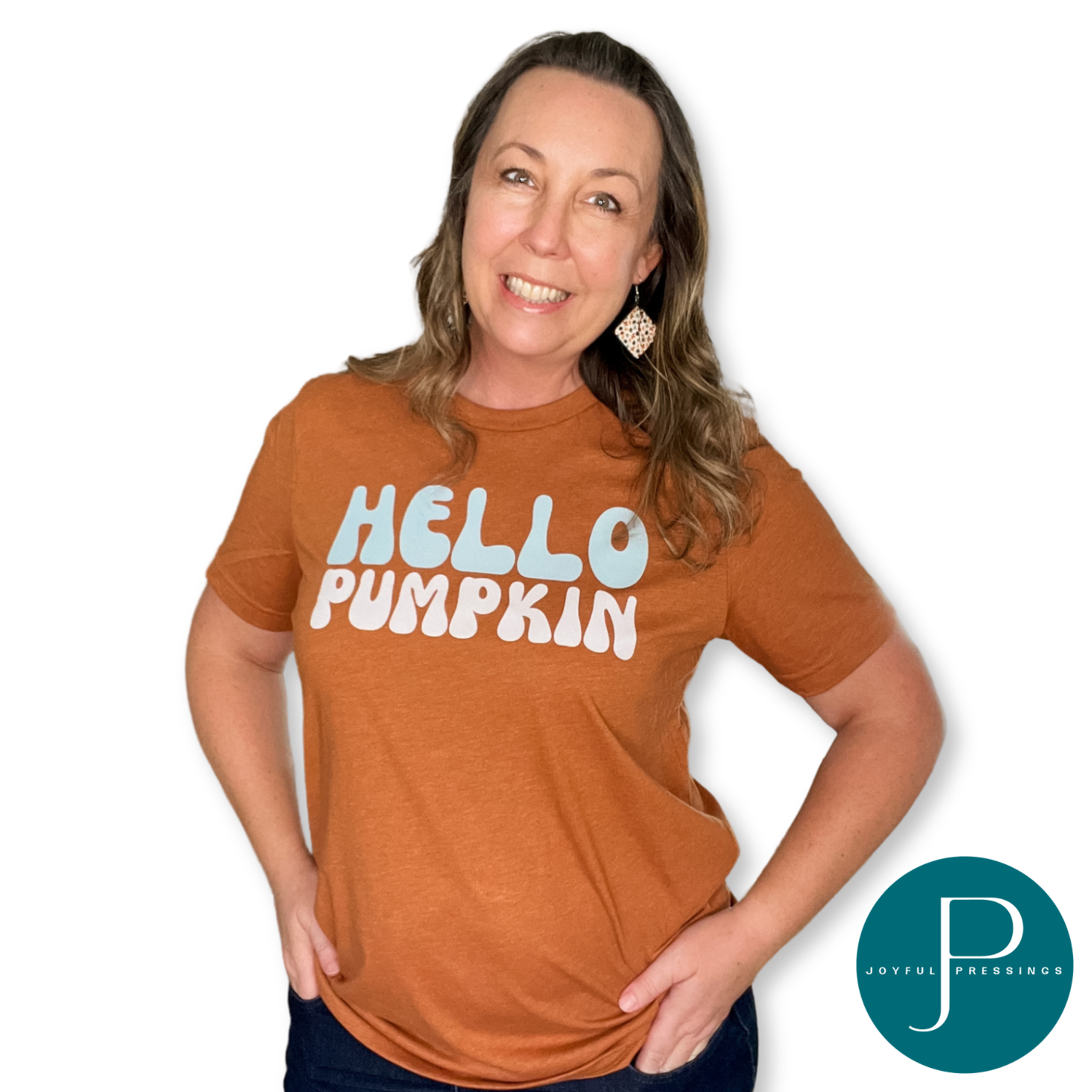 Hello Pumpkin print on a rust color tee on a model.