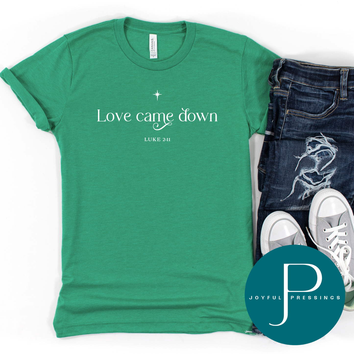 Kelly green Bella + Canvas t-shirt with “Love came down” and Luke 2:11 in white text.