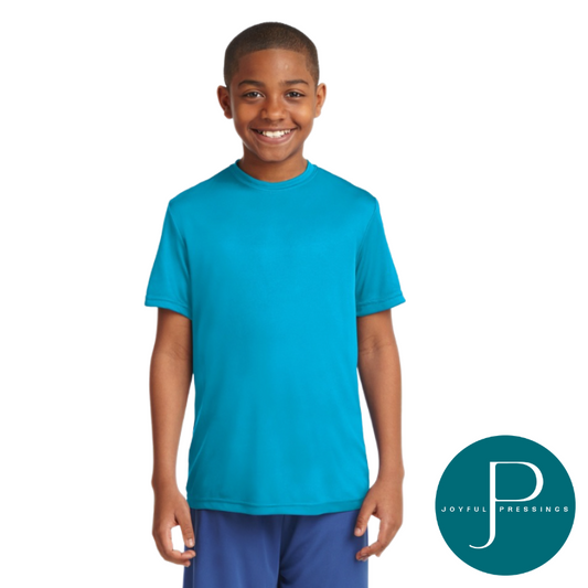 Youth model smiling while wearing a bright blue short-sleeve Sport-Tek PosiCharge shirt, shown from the front.