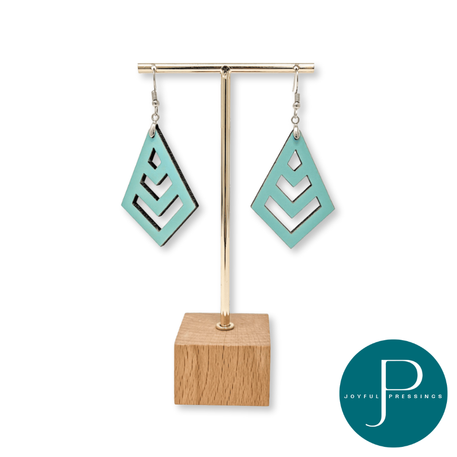 teal macrame earrings on display