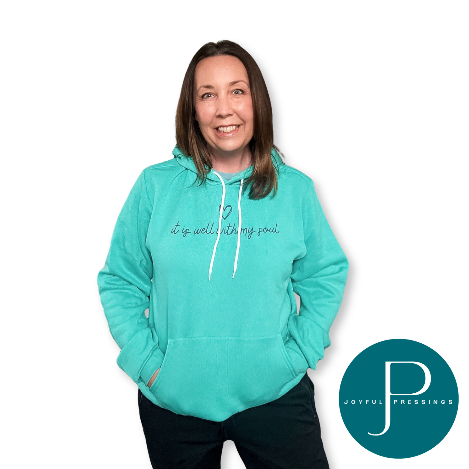 Person wearing a teal hoodie with text, standing against a white background with 'Joyful Pressings' logo.