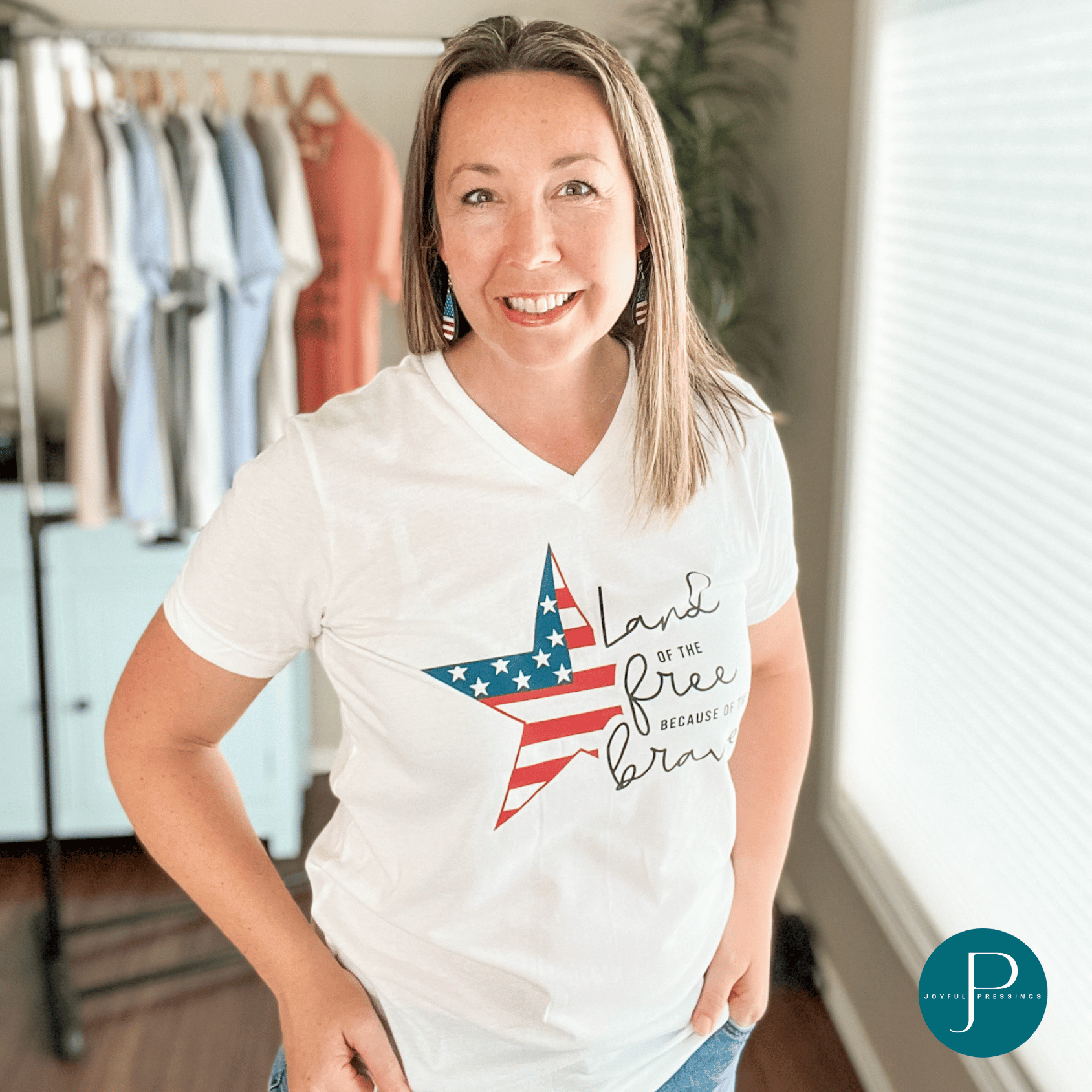 model wearing land of the free white v-neck t-shirt