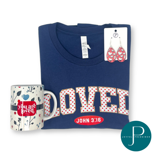 product photo of loved bundle which includes the loved t-shirt, pink heart earrings, and Valentine mug