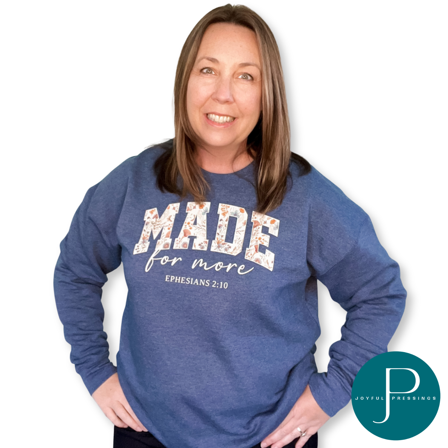 Woman wearing a blue sweatshirt with text that says Made for more Ephesians 2:10, standing against a white background