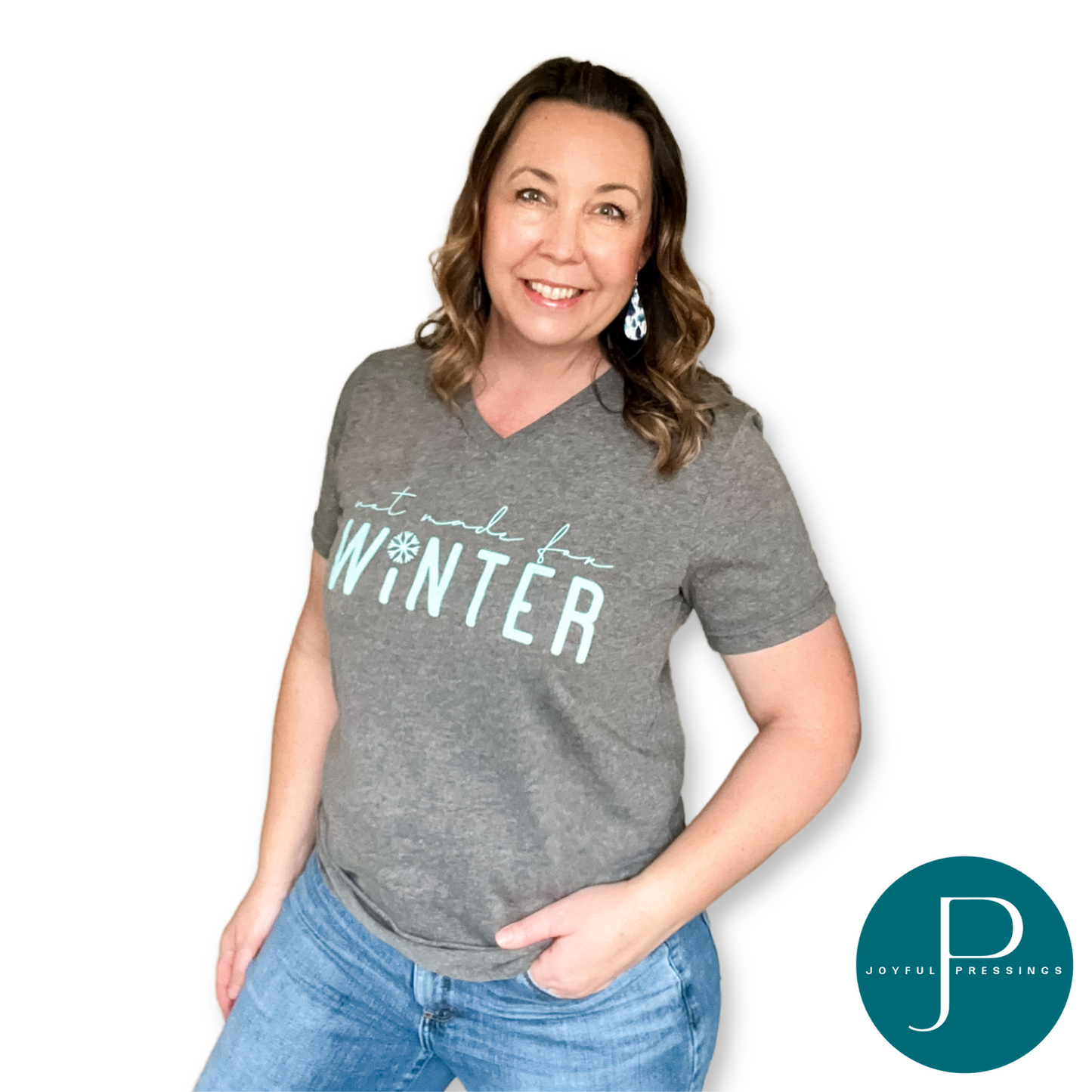 Model wearing gray tee says Not Made for Winter in teal.