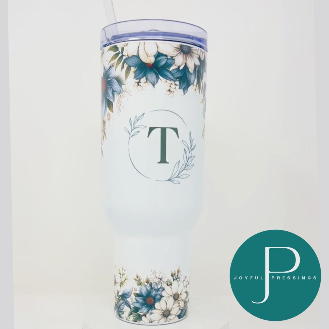 Video showcasing the blue floral tumbler personalized with the letter T.