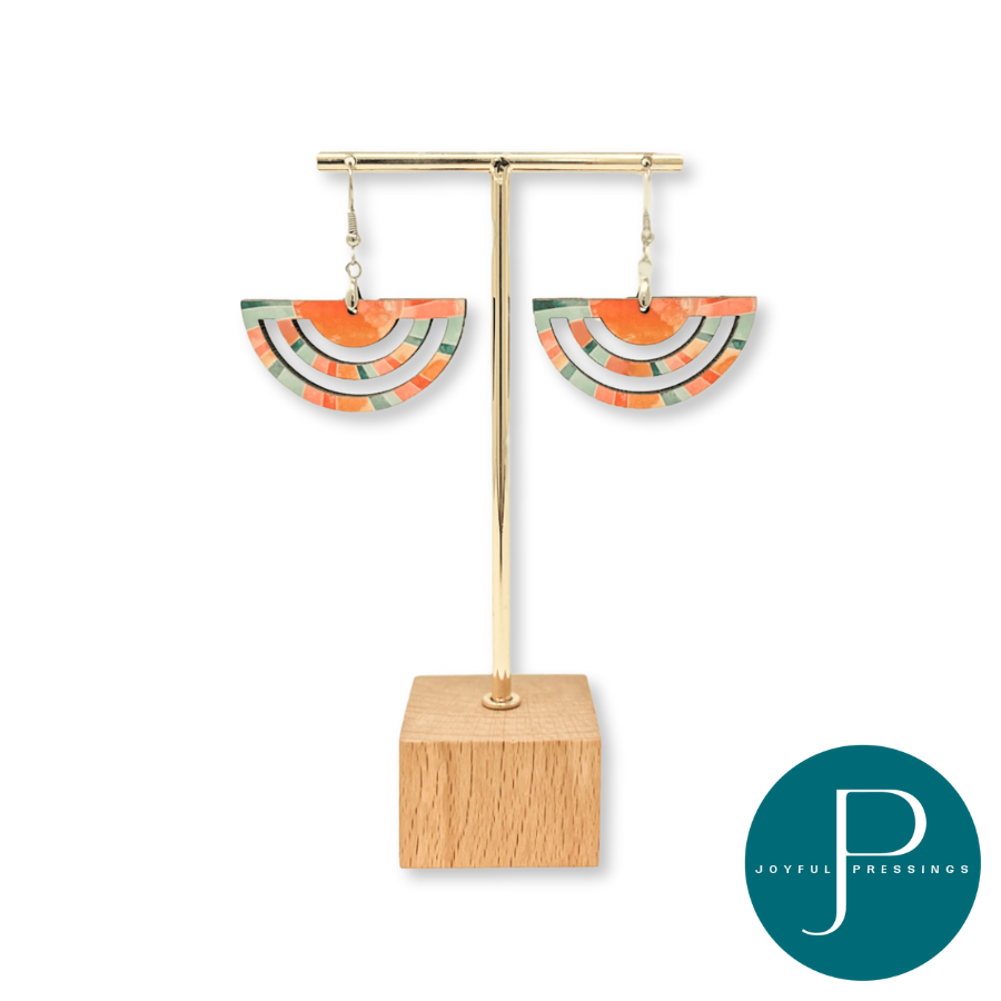 sunkissed earrings on wood and gold display