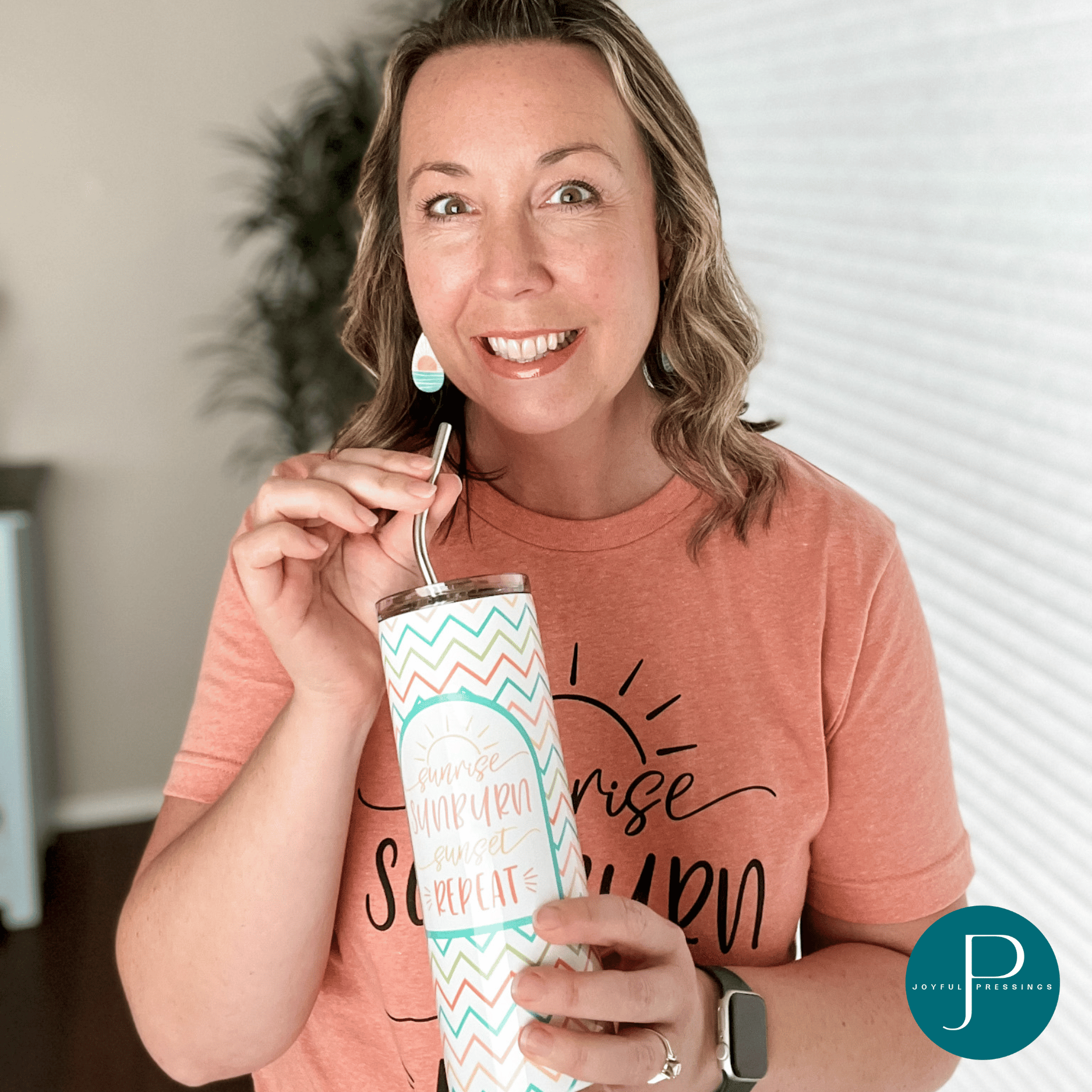 model holding the "Sunrise Sunset" tumbler