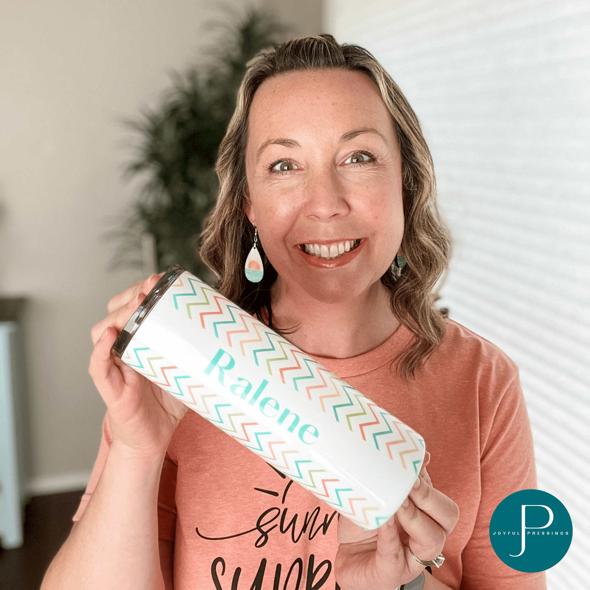 model holding a "Sunrise Sunset" tumbler personalized