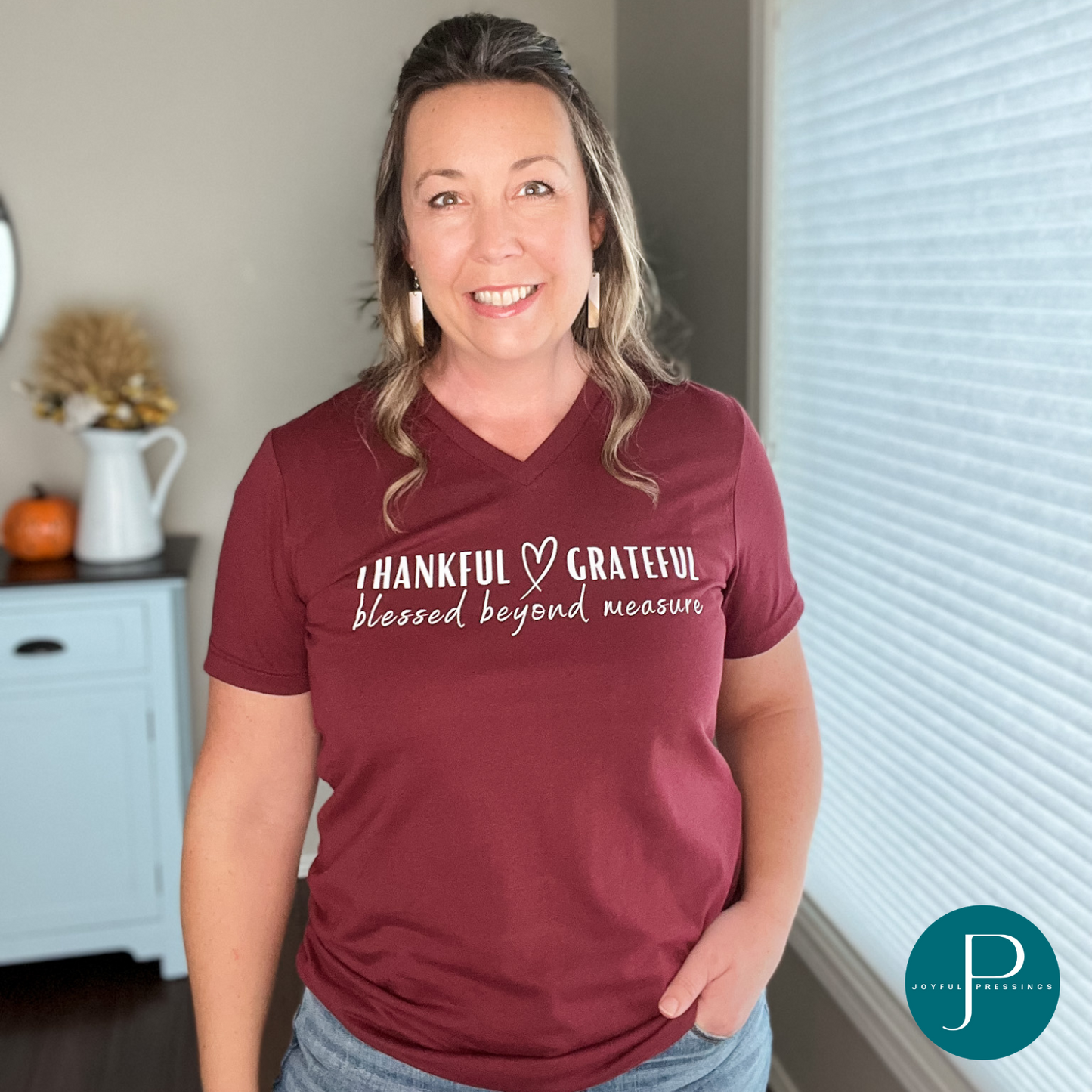 Model wearing Thankful Grateful Blessed Beyond Measure heather cardinal colored graphic t-shirt.