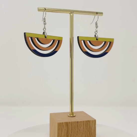 video of half circle sunset macrame style earrings